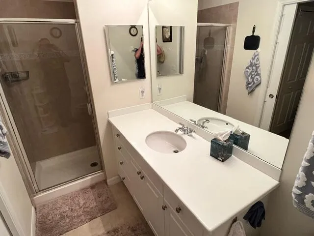 a bathroom with a sink and mirror