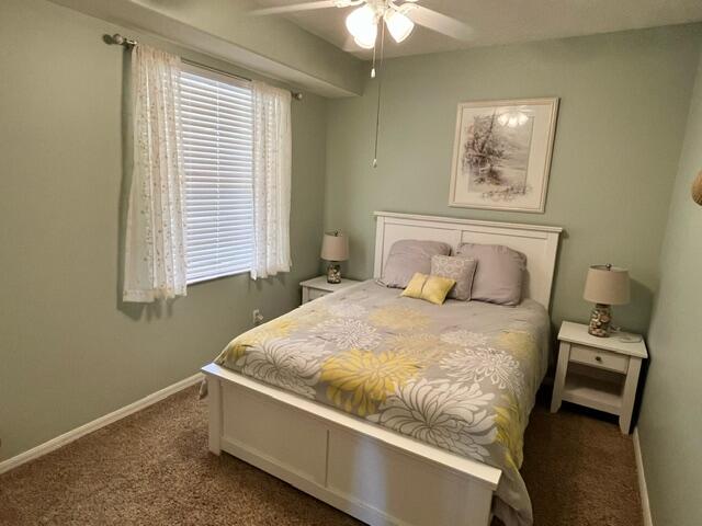 6828 Toland Drive, Unit 302 Melbourne, FL 32940 - Photo 20 of 45 a bedroom with a bed and a window