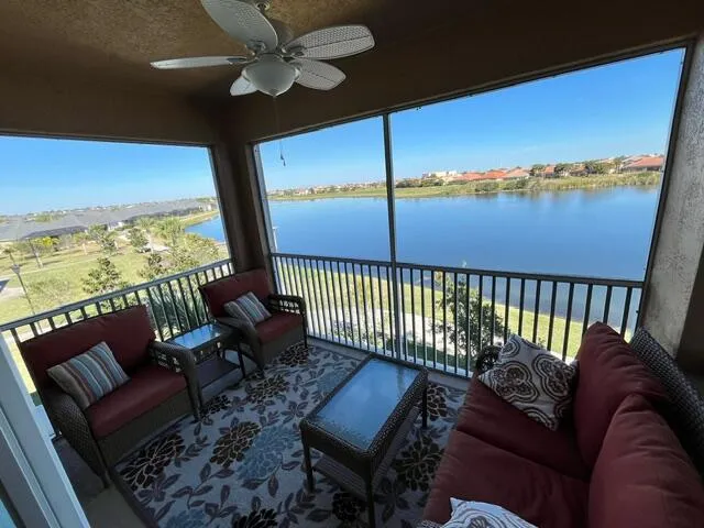 a roof deck with a table and chairs