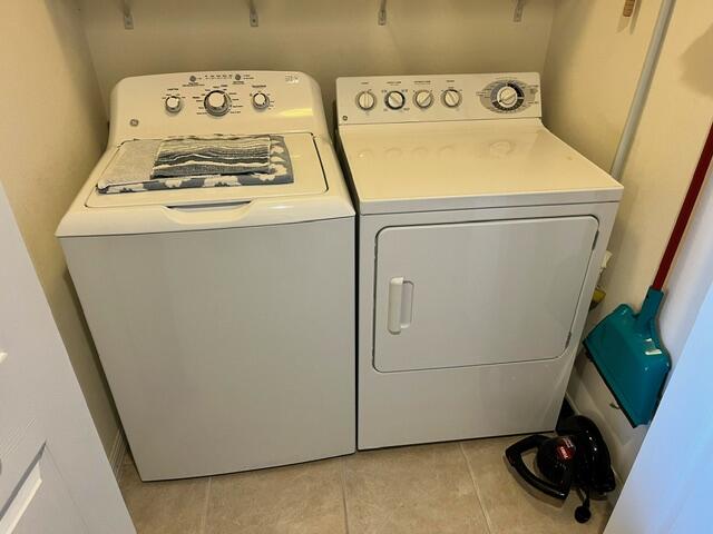 6828 Toland Drive, Unit 302 Melbourne, FL 32940 - Photo 21 of 45 a utility room with dryer and washer