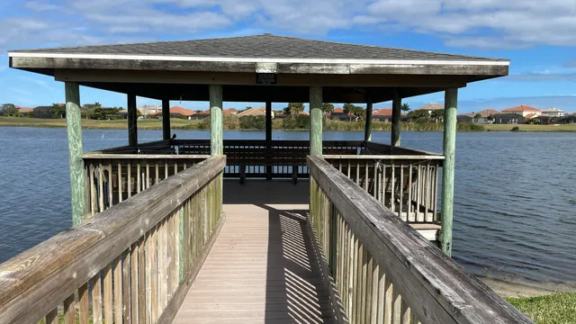 a view of a balcony with wooden floor