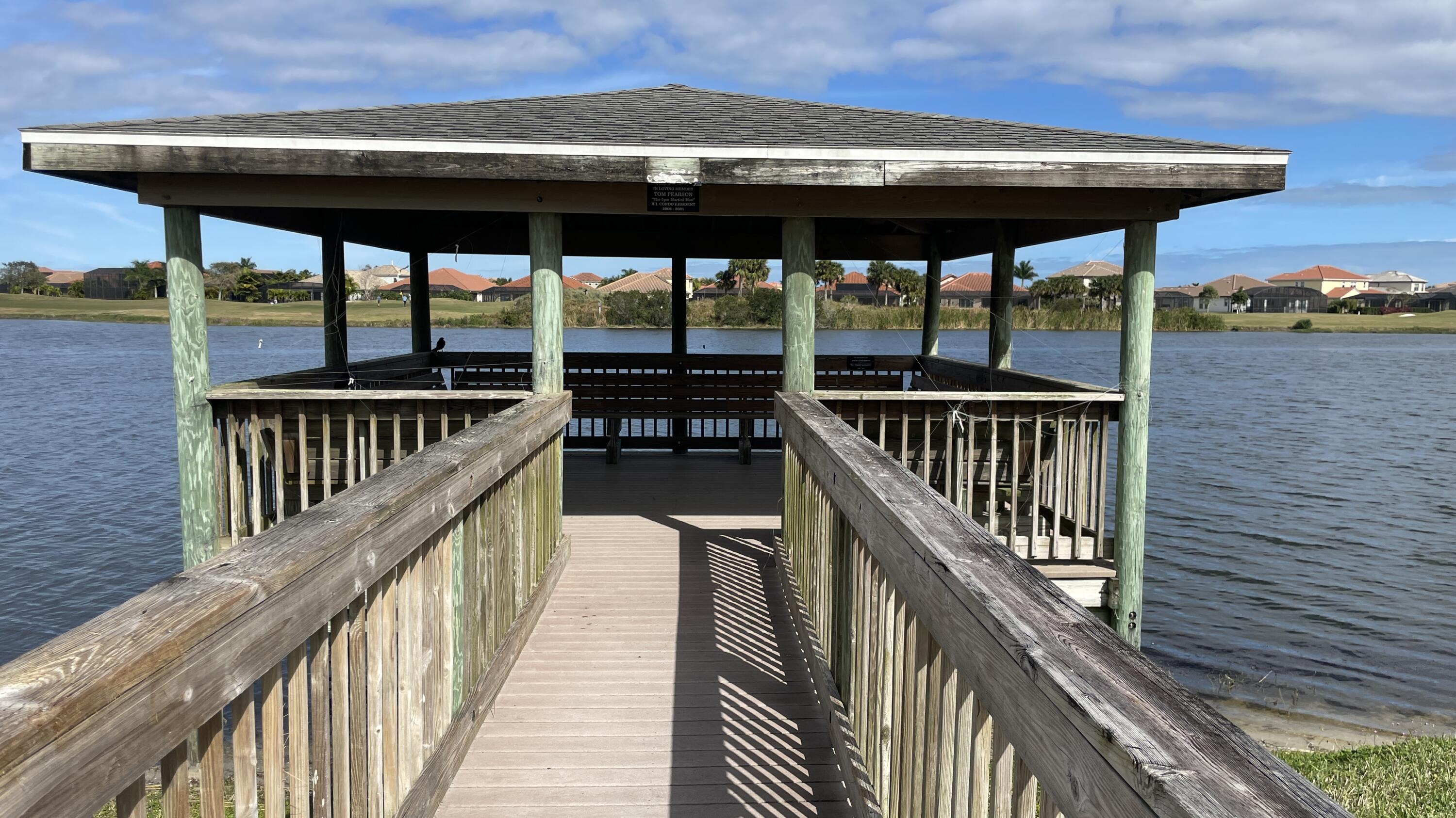 6828 Toland Drive, Unit 302 Melbourne, FL 32940 - Photo 28 of 45 a view of a balcony with wooden floor