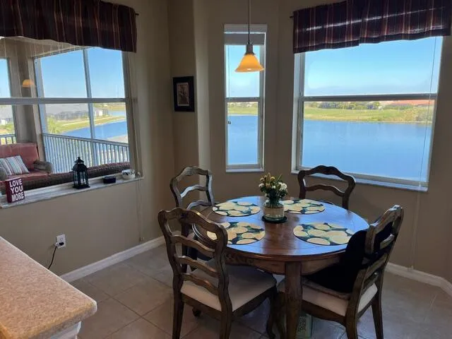 a view of a dining room with furniture and window