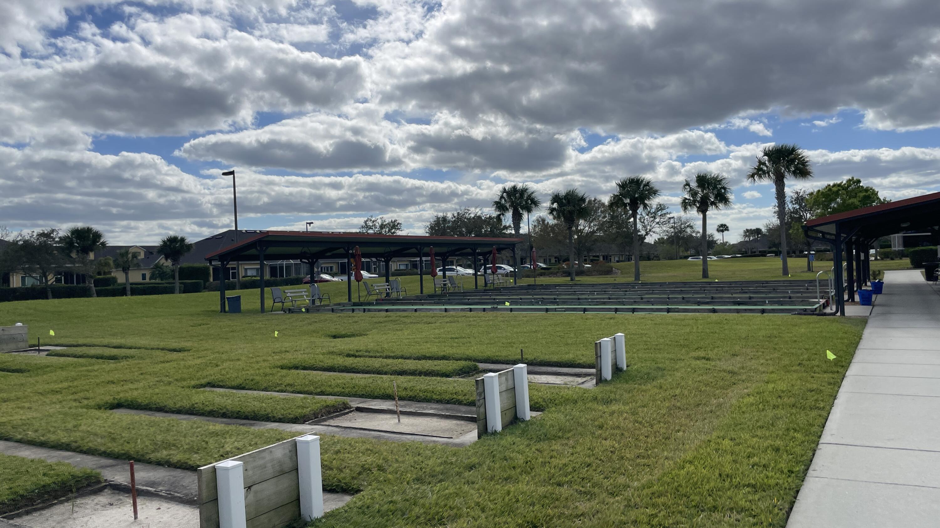 6828 Toland Drive, Unit 302 Melbourne, FL 32940 - Photo 32 of 45 a view of a park with big trees