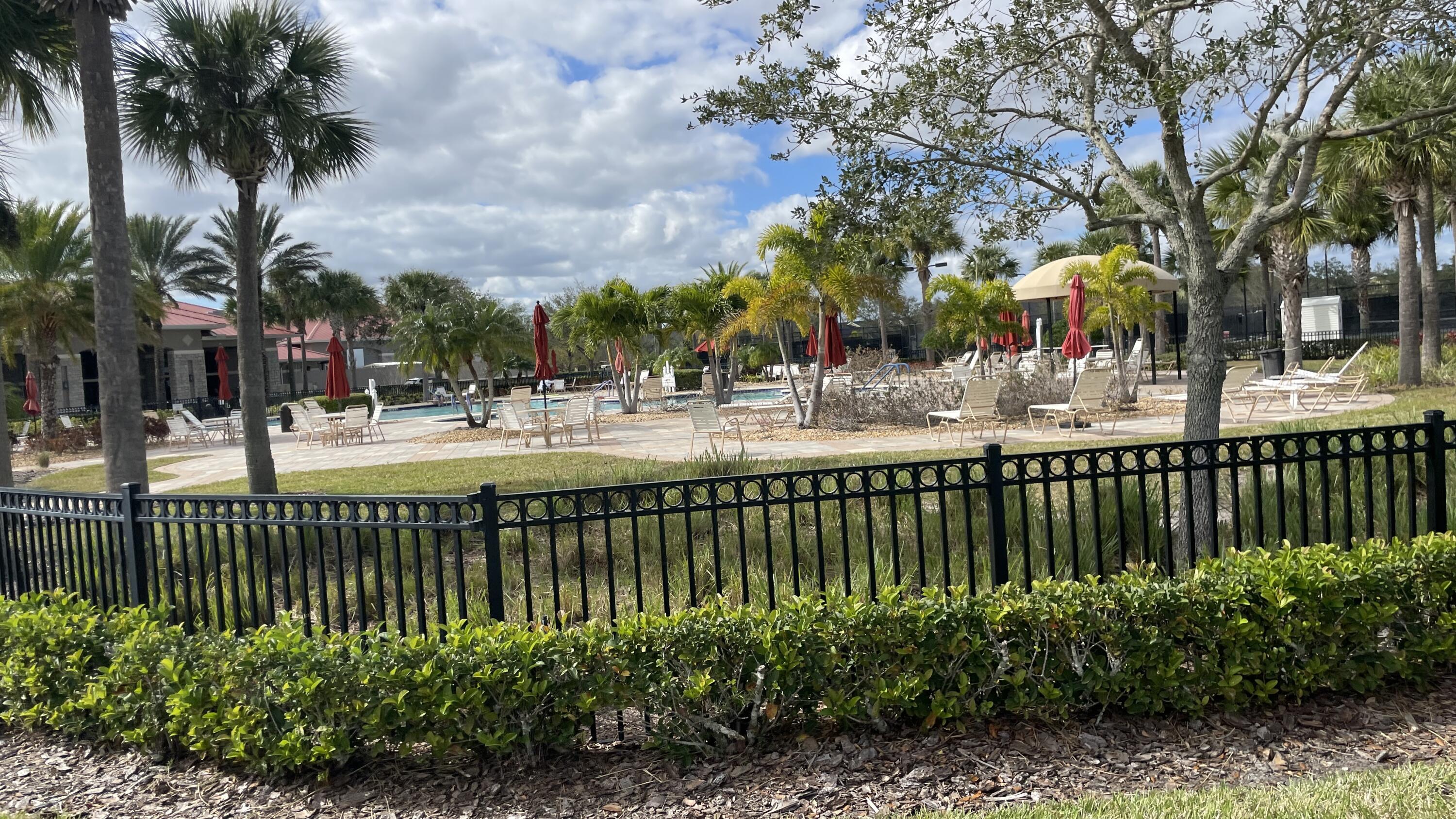 6828 Toland Drive, Unit 302 Melbourne, FL 32940 - Photo 35 of 45 a view of a garden and a slide