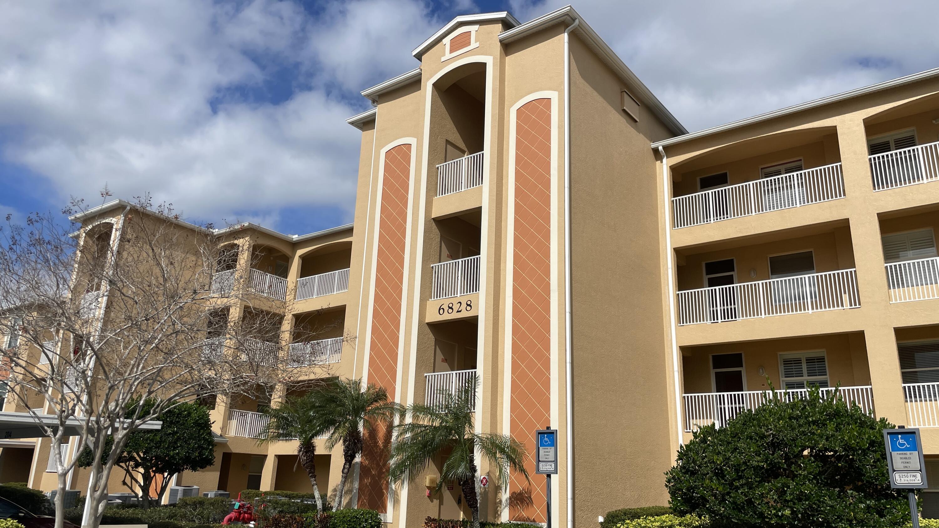6828 Toland Drive, Unit 302 Melbourne, FL 32940 - Photo 45 of 45 a front view of a building