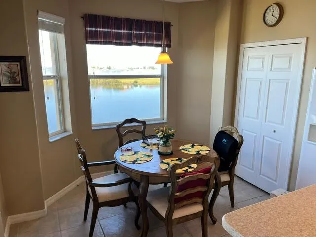 a view of a dining room with furniture and window