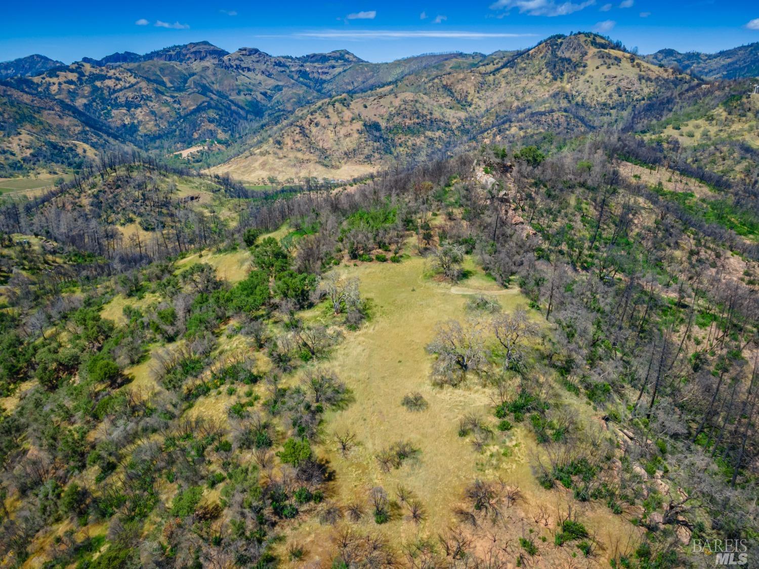 0 Silverado Trail North Calistoga, CA 94515 - Photo 27 of 82 a view of a dry yard with mountains in the background