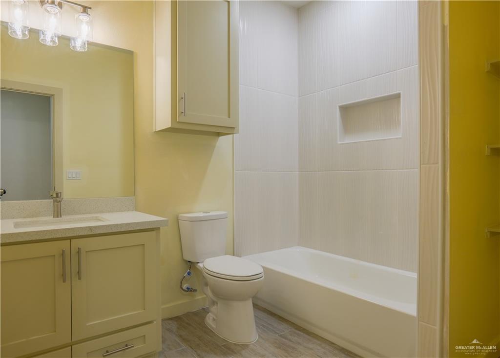 3086 Briggs Road, Unit C Weslaco, TX 78596 - Photo 11 of 11 a bathroom with a sink a toilet and shower
