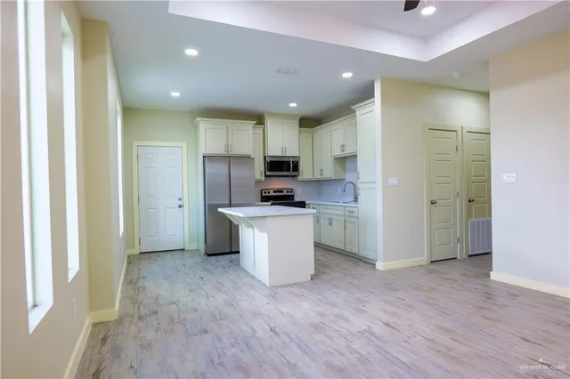 a view of a kitchen with electric appliances