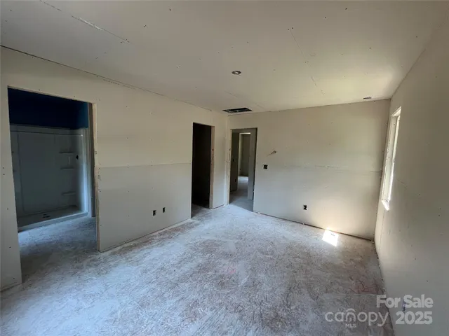 an empty room with a bathroom