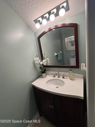 a bathroom with a toilet and a sink