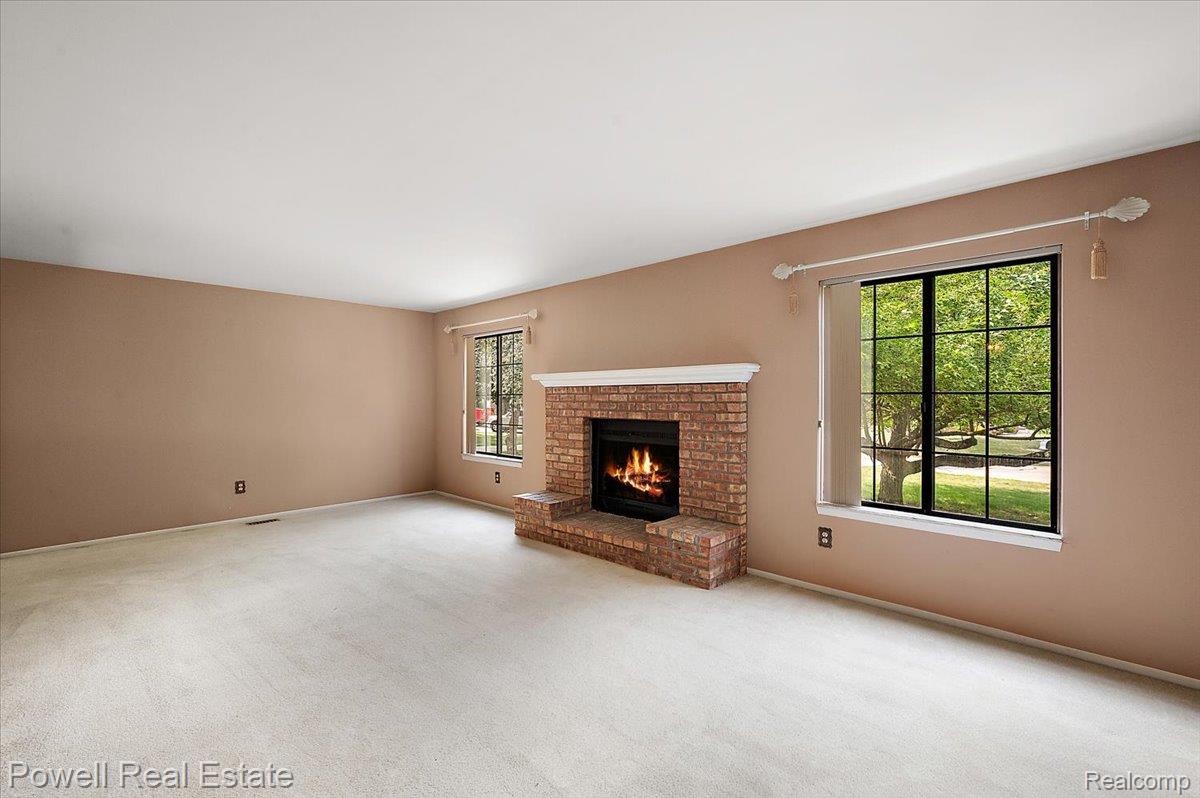1938 Allenway Court Rochester, MI 48309 - Photo 13 of 39 Living Room with wood burning fireplace. (1 of 2)