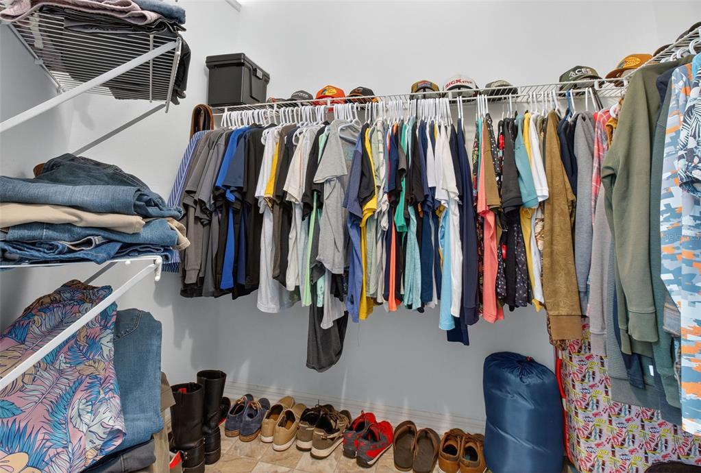 8841 Kipling Avenue Hudson, FL 34667 - Photo 19 of 41 a view of walk in closet with clothes and shoes