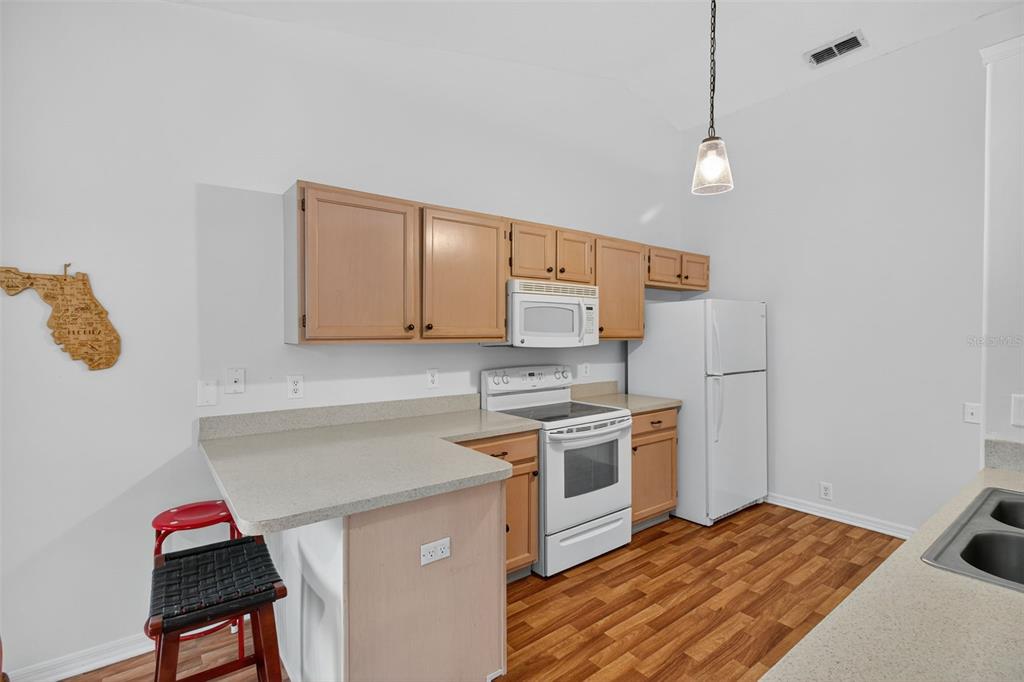 8841 Kipling Avenue Hudson, FL 34667 - Photo 25 of 41 a kitchen with stainless steel appliances granite countertop a stove and a sink