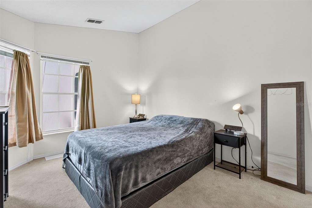 8841 Kipling Avenue Hudson, FL 34667 - Photo 29 of 41 a bedroom with a bed and a window