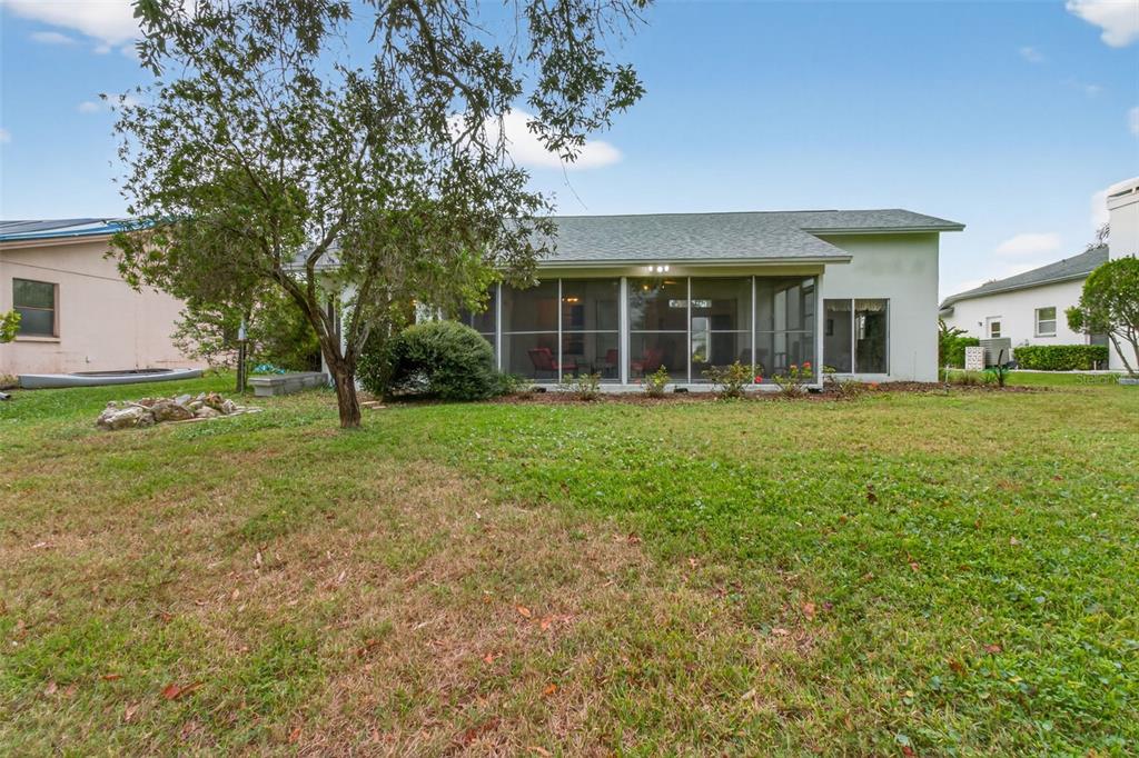 8841 Kipling Avenue Hudson, FL 34667 - Photo 35 of 41 front view of a house with a yard