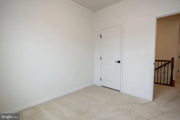 an empty room with a bathroom