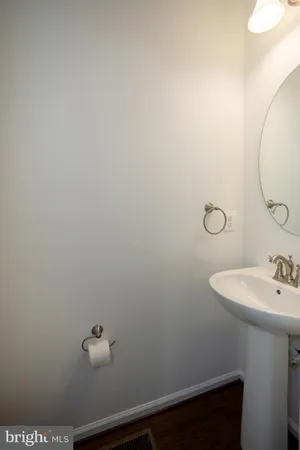 a bathroom with a sink and vanity