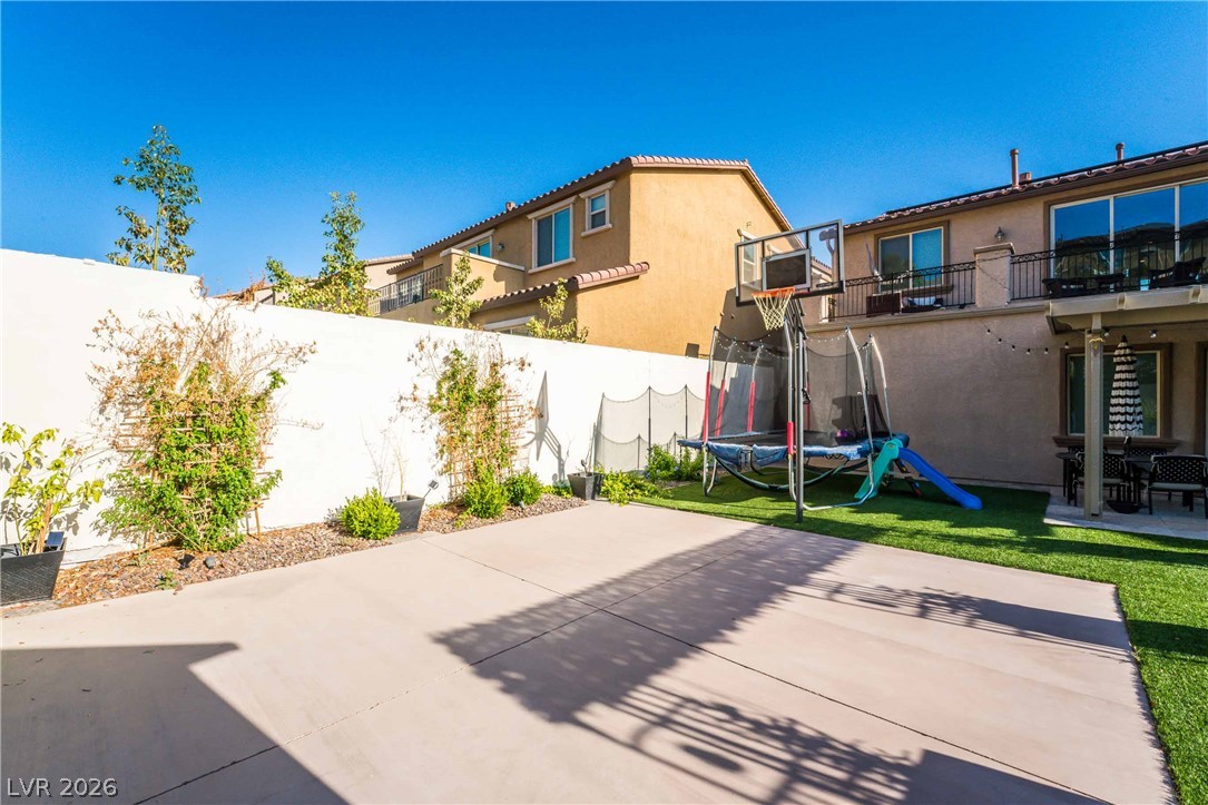 2787 Athens Ridge Drive Henderson, NV 89052 - Photo 28 of 31 An inviting backyard oasis offers both recreation and relaxation.