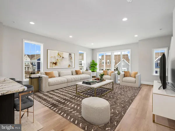a living room with fireplace furniture and a table