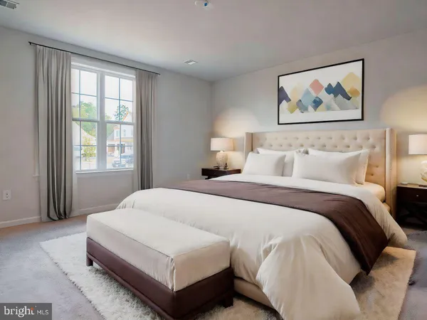 a bedroom with a large bed and a window