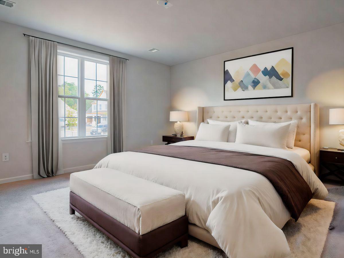 104 Merchant Avenue, Unit CARTER Mount Joy, PA 17552 - Photo 7 of 23 a bedroom with a large bed and a window