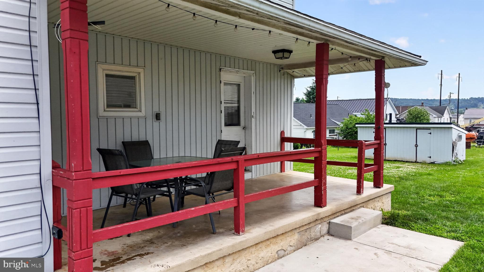 14 North Kinzer Road Kinzers, PA 17535 - Photo 18 of 34 Charming porch with vibrant red accents.