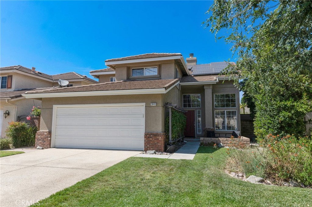 3843 San Gabriel Street Simi Valley, CA 93063 - Photo 6 of 52 a front view of a house with a garden and yard