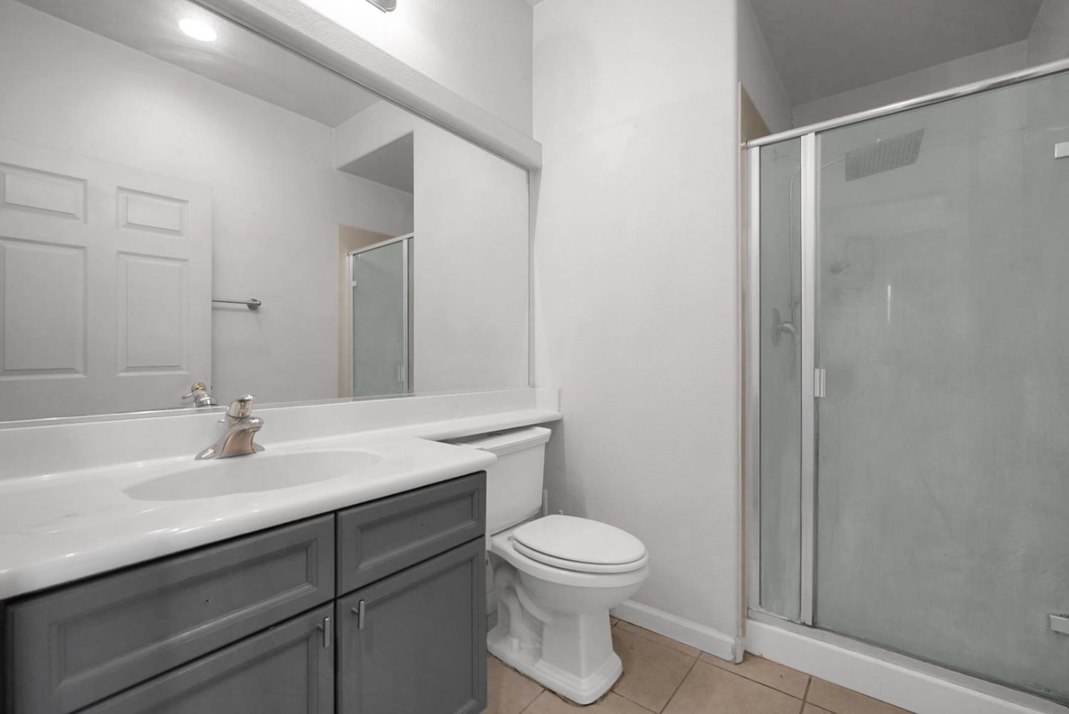 1412 Red Ribbons Lane Manteca, CA 95337 - Photo 12 of 32 a bathroom with a sink a toilet and shower