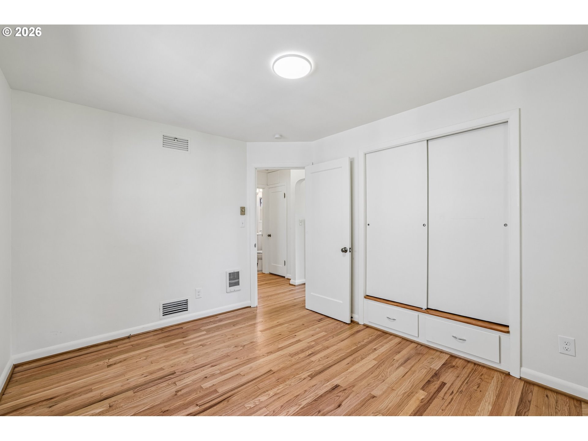 536 28th Avenue Longview, WA 98632 - Photo 13 of 26 a view of an empty room with wooden floor