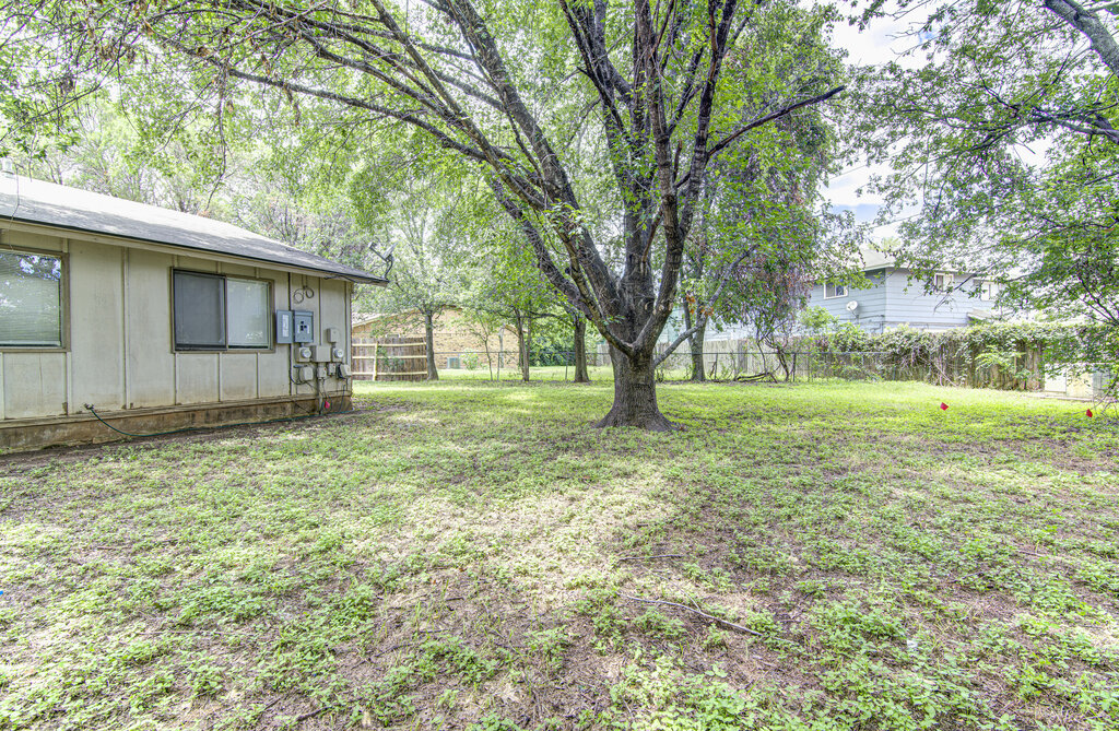5301 Indio Circle, Unit A Austin, TX 78745 - Photo 23 of 25 A spacious backyard with mature trees offers a private green oasis.