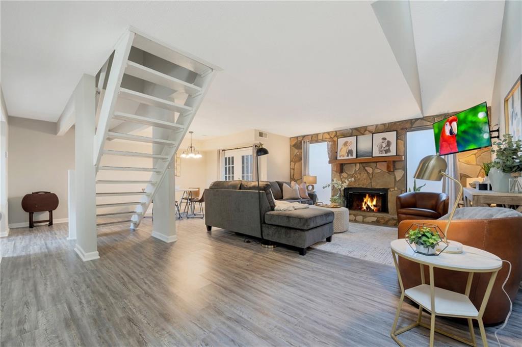 Undisclosed Address Marietta, GA 30064 - Photo 1 of 25 a living room with furniture and a wooden floor