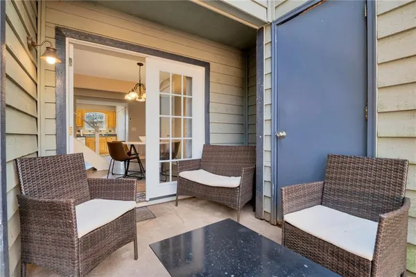 a outdoor living space with furniture and a potted plant