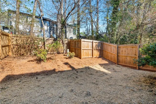 a view of backyard and trees
