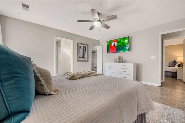 a bedroom with a bed and a television