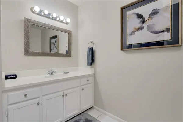 a bathroom with a sink and mirror