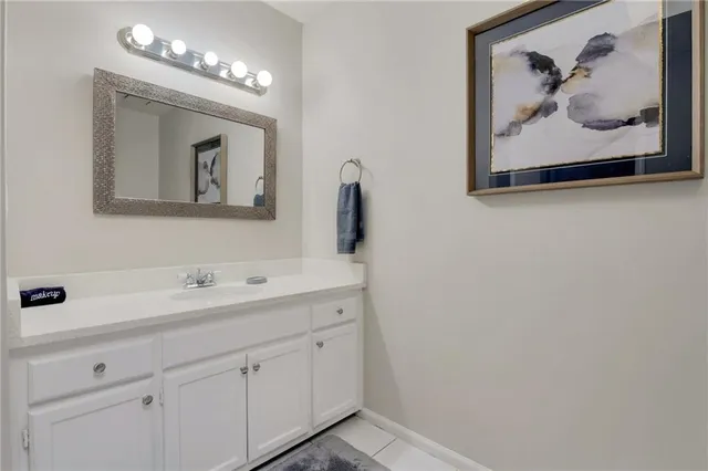 a bathroom with a sink and mirror