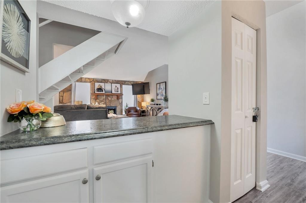 Undisclosed Address Marietta, GA 30064 - Photo 10 of 25 a kitchen with stainless steel appliances granite countertop a sink and a white cabinets