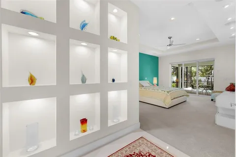 a living room with patio furniture and a flat screen tv