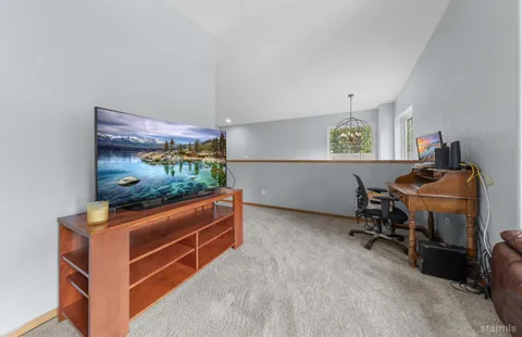 a room with furniture and a flat screen tv