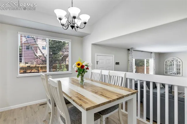 a view of a dining room with furniture window and chandelier