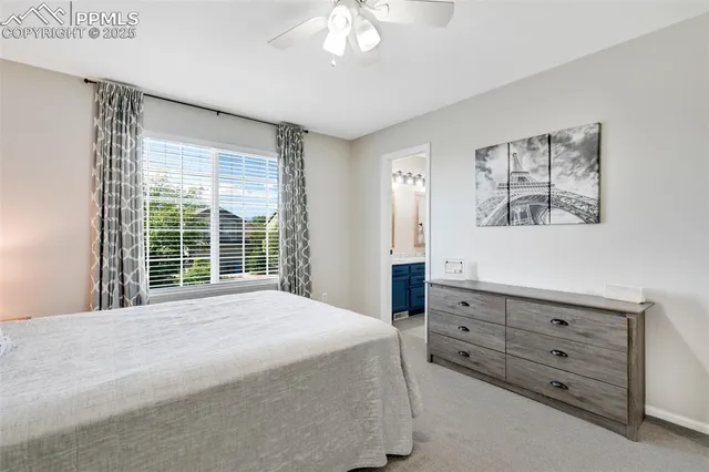 a spacious bedroom with a bed and a window