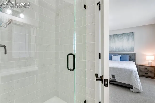a bathroom with a tub and a shower