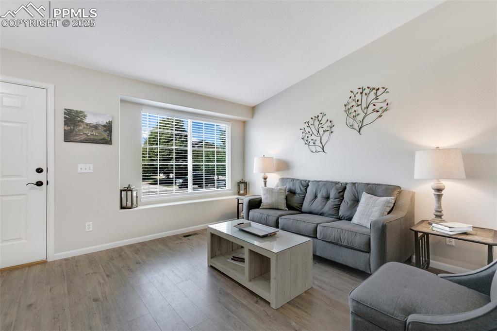 3615 Bareback Drive Colorado Springs, CO 80922 - Photo 5 of 27 a living room with furniture and a large window