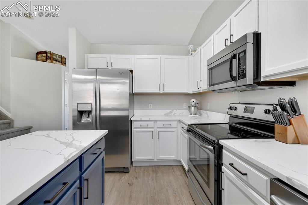 3615 Bareback Drive Colorado Springs, CO 80922 - Photo 10 of 27 a kitchen with stainless steel appliances granite countertop a sink stove and refrigerator
