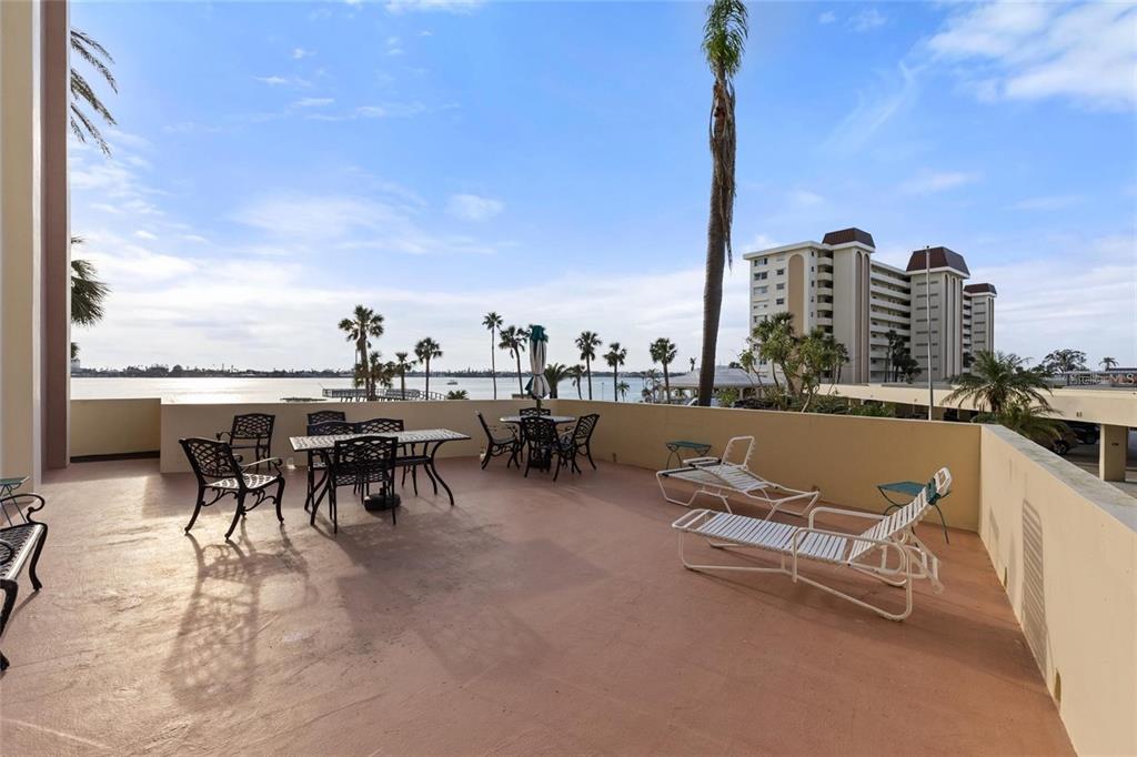 4775 Cove Circle, Unit 202 St. Petersburg, FL 33708 - Photo 15 of 19 a view of a terrace with furniture and city view