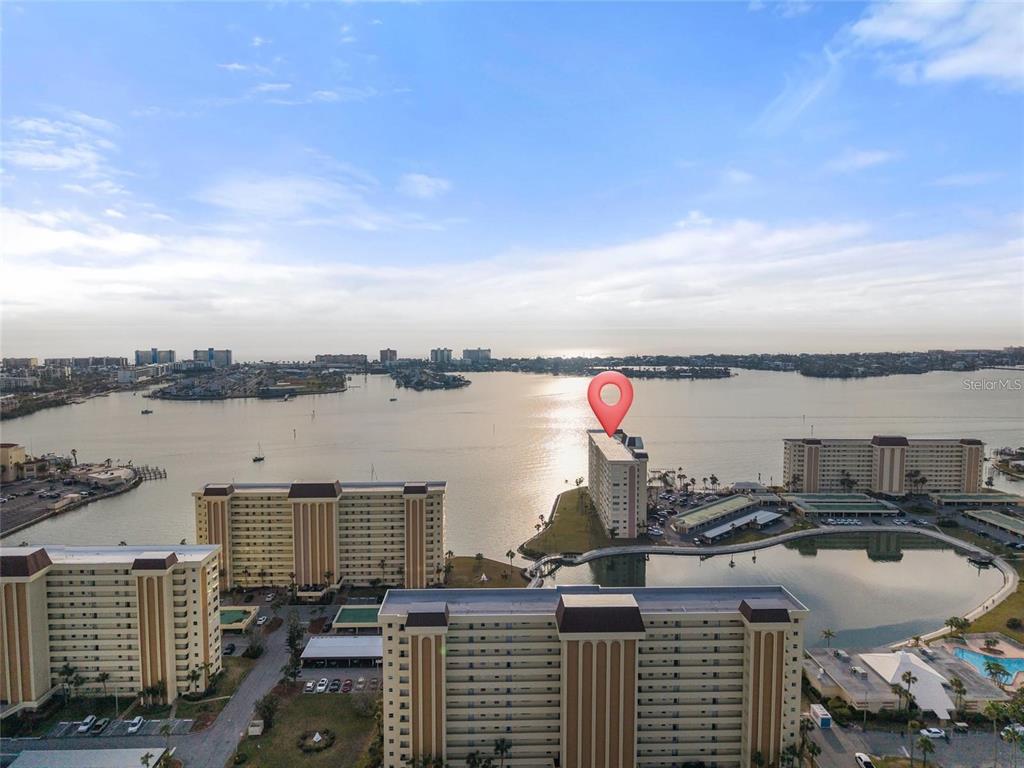 4775 Cove Circle, Unit 202 St. Petersburg, FL 33708 - Photo 18 of 19 a view of a lake and a city