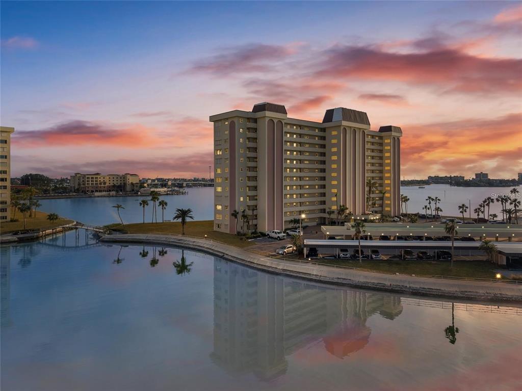 4775 Cove Circle, Unit 202 St. Petersburg, FL 33708 - Photo 2 of 19 a view of a city with tall buildings