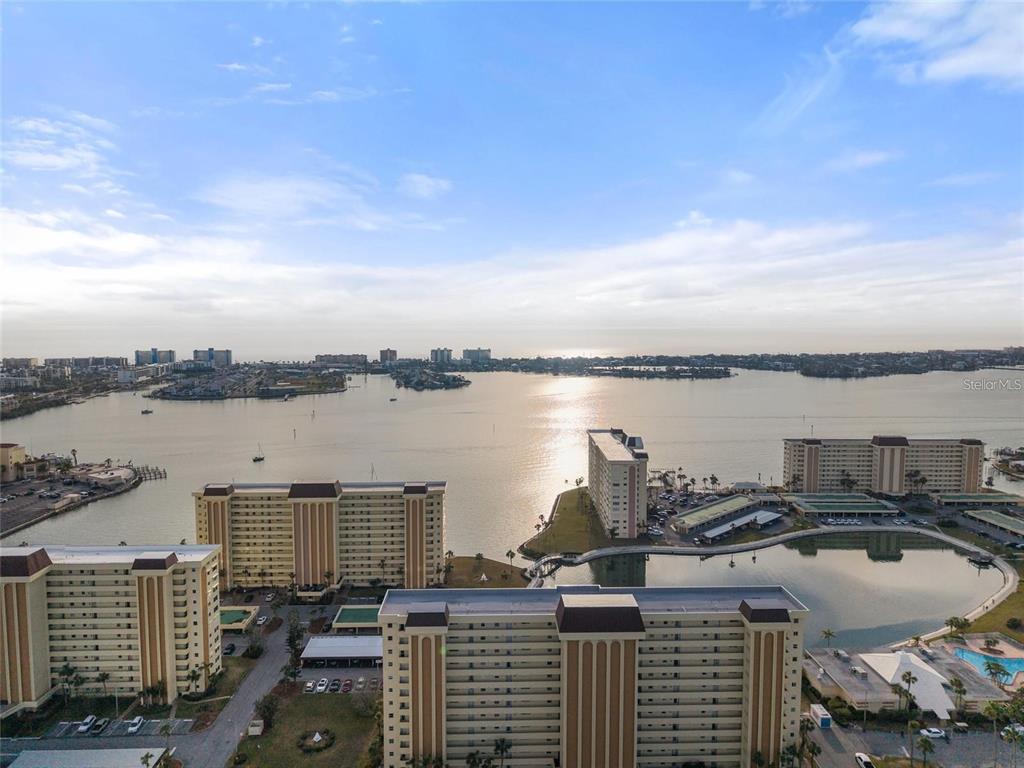 4775 Cove Circle, Unit 202 St. Petersburg, FL 33708 - Photo 3 of 19 a view of a lake from a balcony